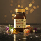 Jar of wild organic honey, 500g, with golden honey and honeycomb.