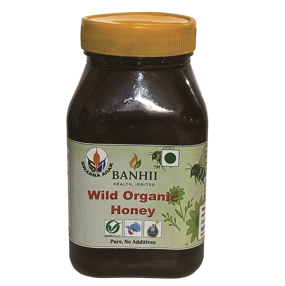 Jar of wild organic honey, 500 grams, showing golden honey texture.